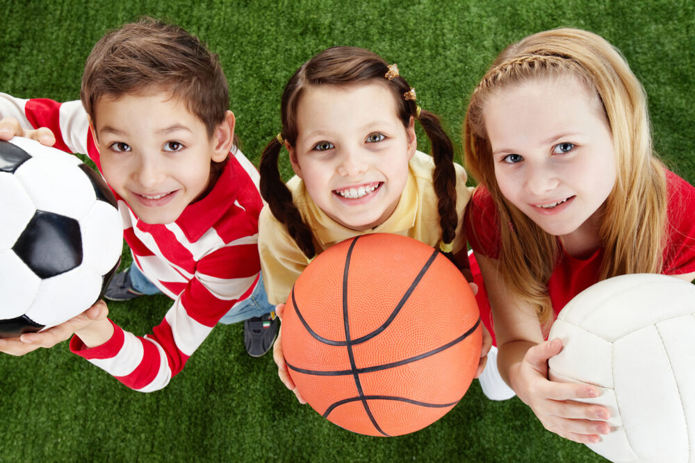 Children with various sports balls